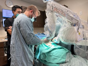 Alternate image of doctor with Yomi Implant Machine